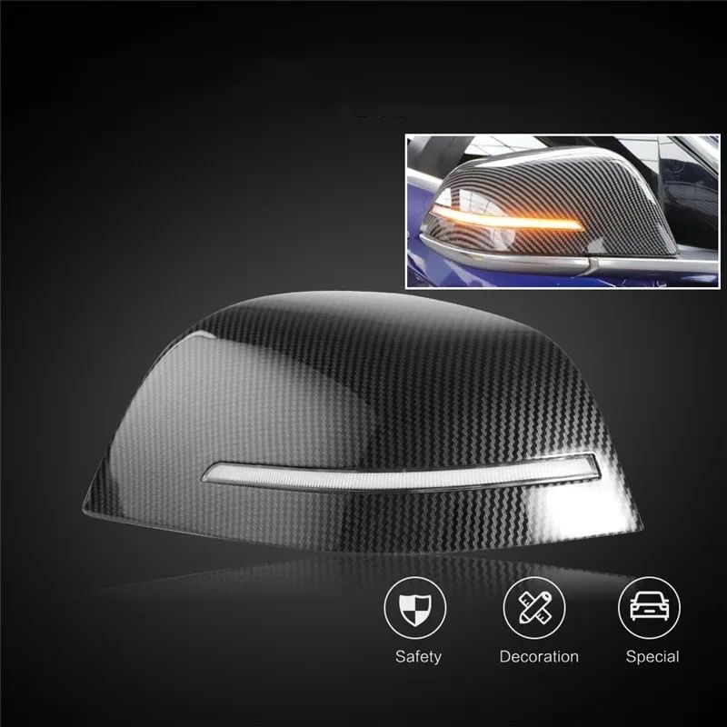 Carbon-look Tesla mirror caps with an integrated sequential turn signal